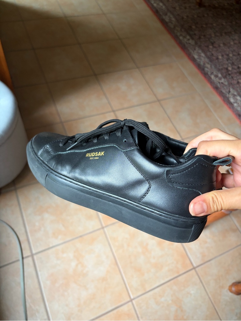 RUDSAK Black Leather Low-Top Sneaker with Gold Logo